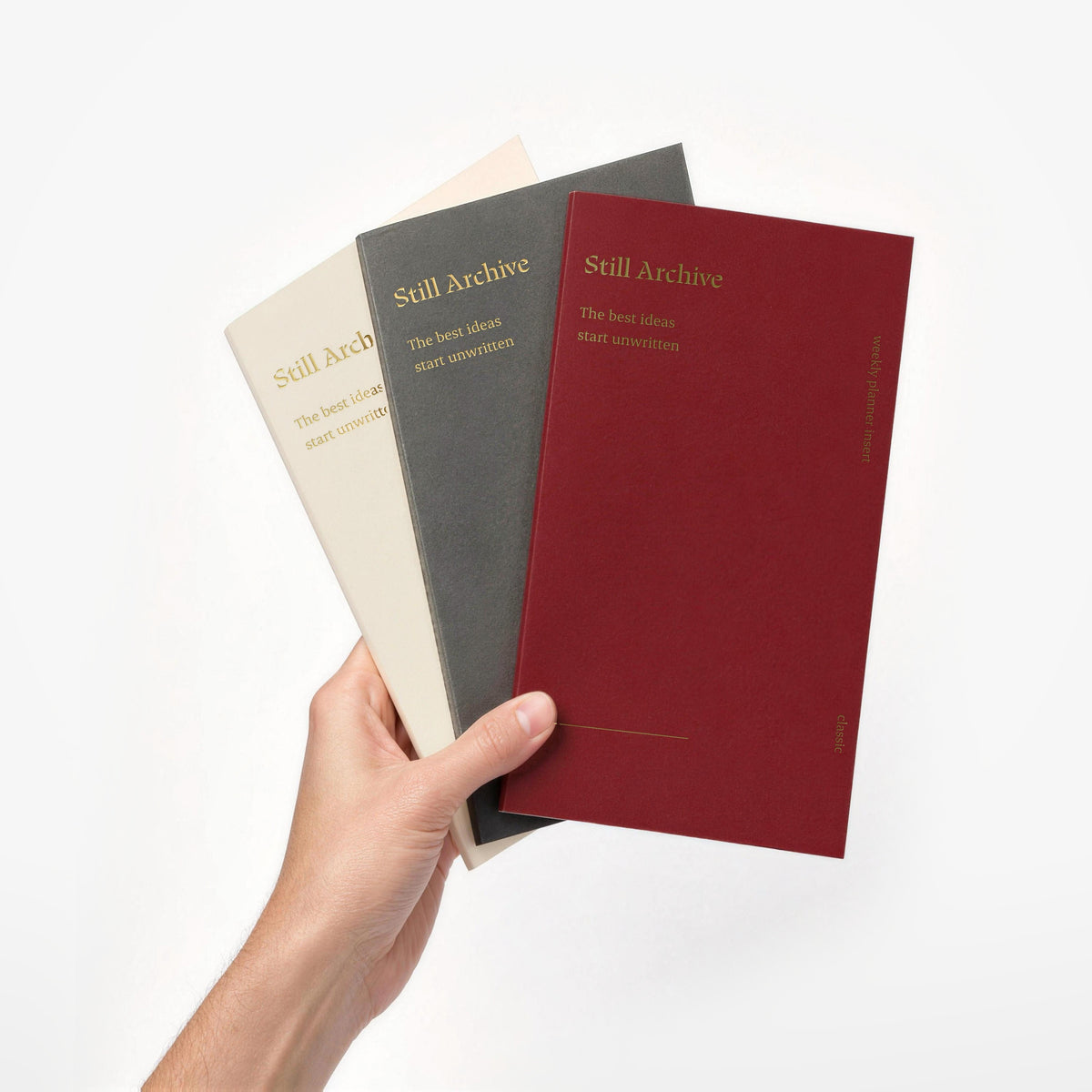 Weekly, monthly and grid planner inserts for the Still Archive Classic journal, held in one hand