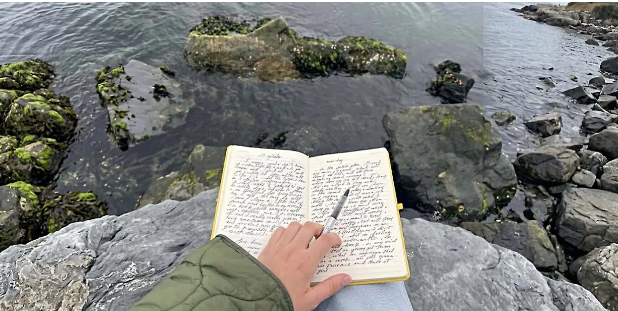 Journaling by the water instead of looking at a phone